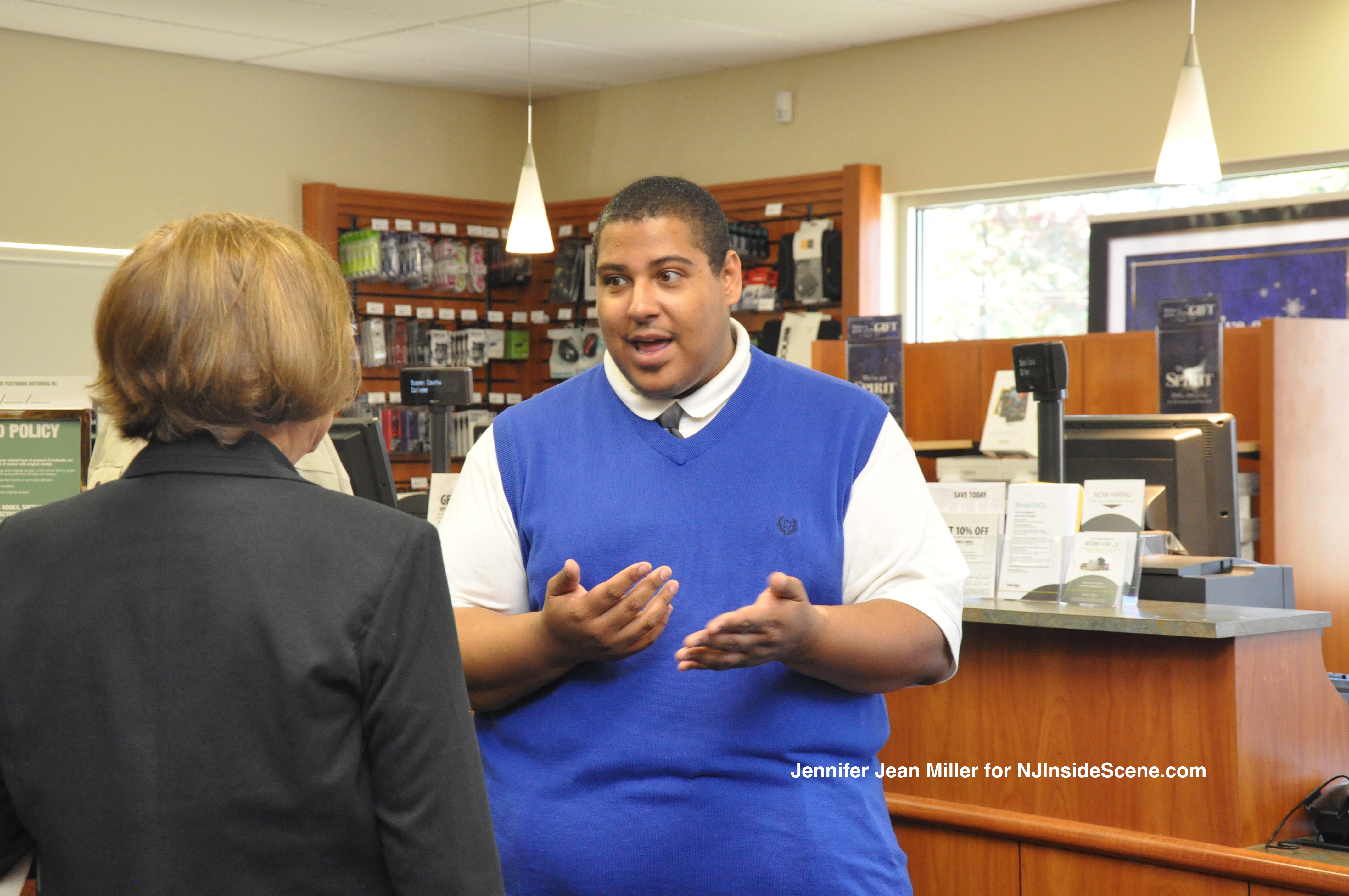 Store manager Erroll Narvaez speaks with a guest. 