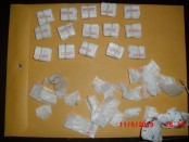 150-bags of Heroin stamped "JORDAN" and numerous empty glassine bags thata re stamped "ROSE" along with a bloody tissue, these were some of the evidence seized during a search of a motor vehicle being driven by a Sussex Couple early Tuesday on Rte. 15. Both were charged with Possession of Heroin and other drug related charges. (Photo courtesy of the Sparta Twp. Police Dept.).