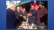 Jonathan Andrews of the Springboard Shoppes (far left), and visitors to the Newton Winter Farmers' Market, stop by the Jersey Barnfire Hot Sauce table for samples, with John Sauchelli (left) and Austin D-Almeida (right), the team that created the original sauce.