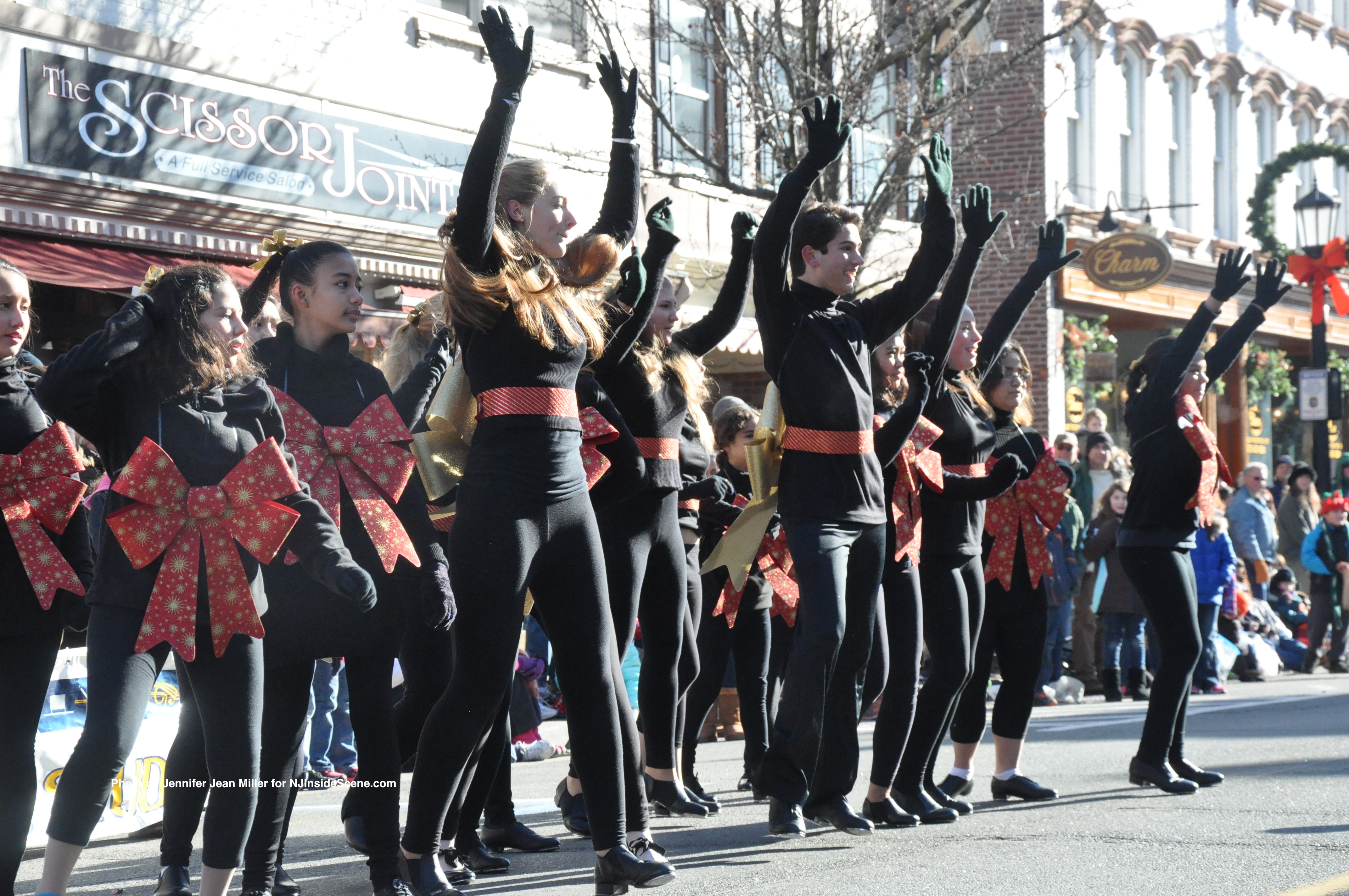 Dancers from D'Marge Dance Studio perform for spectators on both sides of the street.
