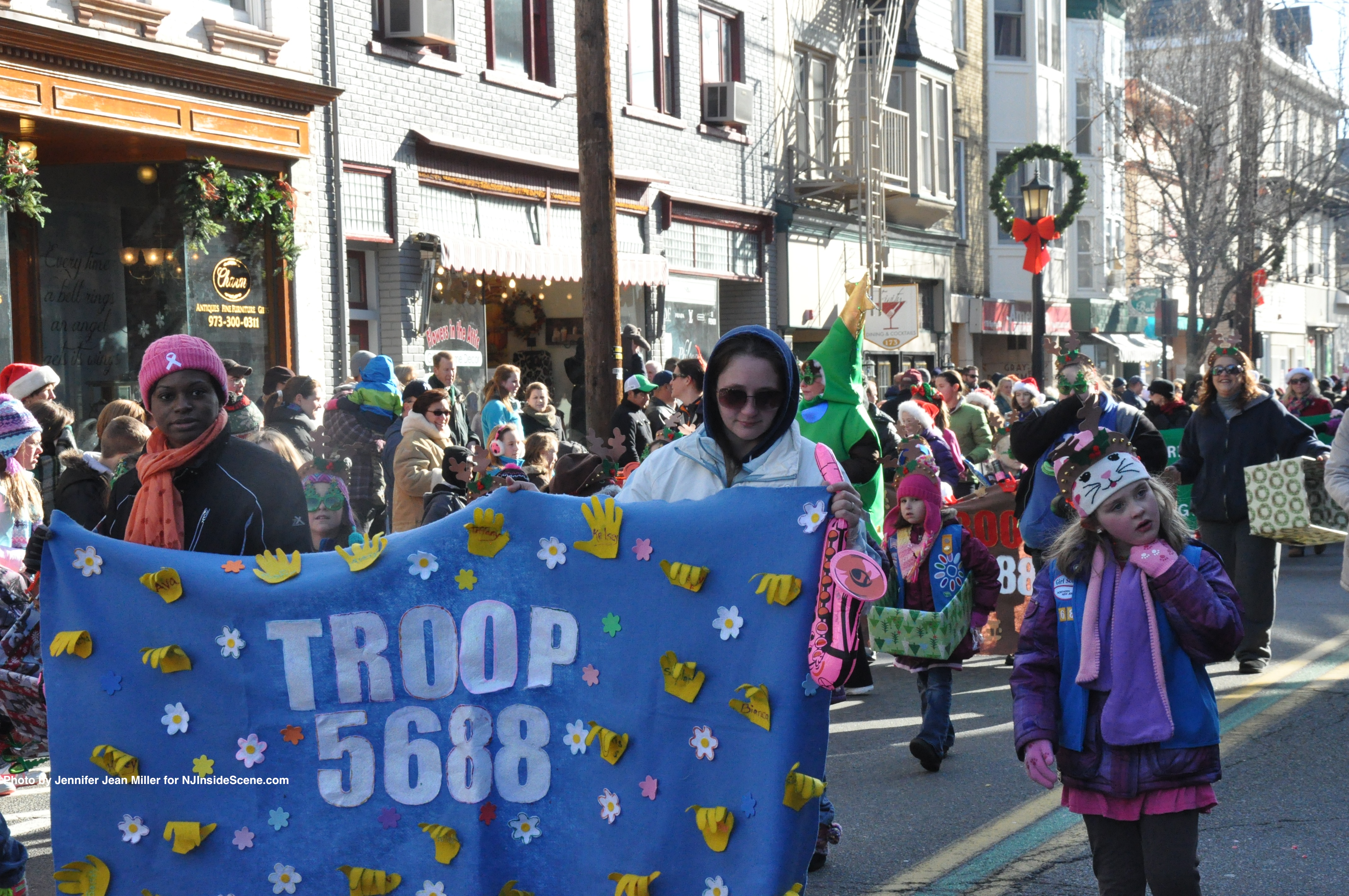 A sea of Girl Scouts push their way through Spring Street.