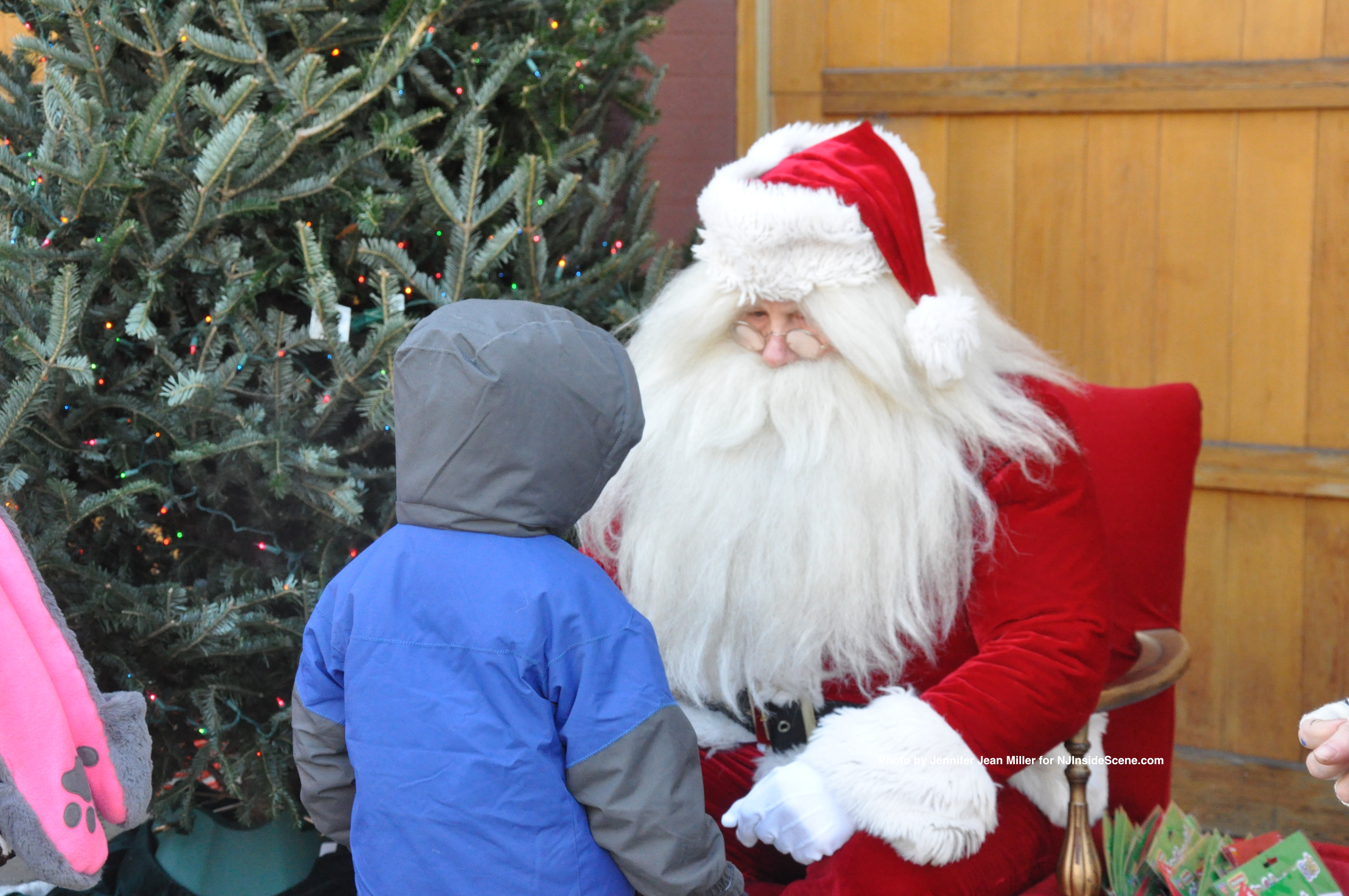 Following the parade, a young man visits Santa.