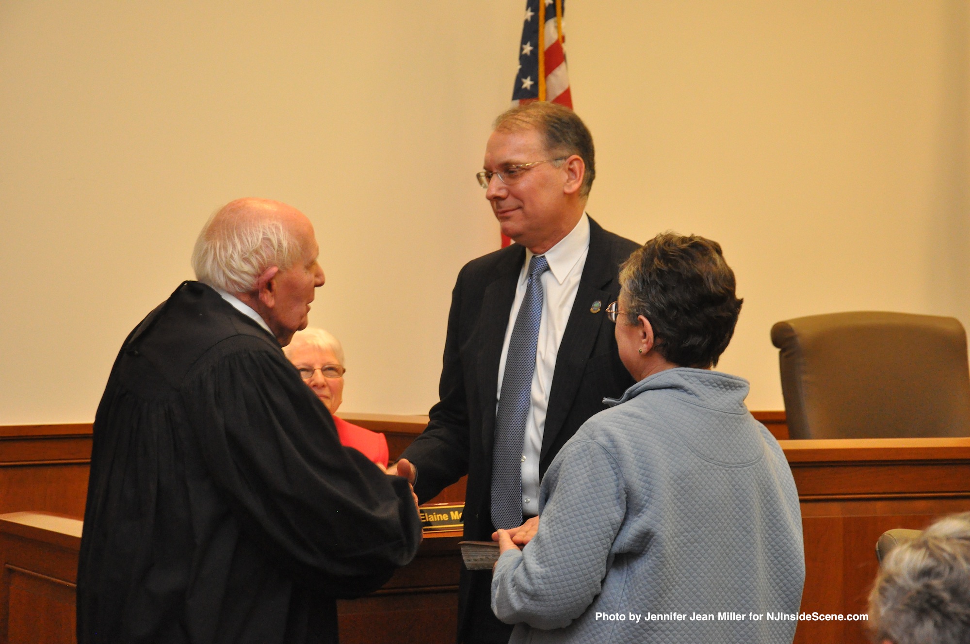 Dennis Mudrick, as he is sworn in as Deputy Director of the Sussex County Board of Chosen Freeholders, with his mother, Ann, and Judge Frederic Weber.