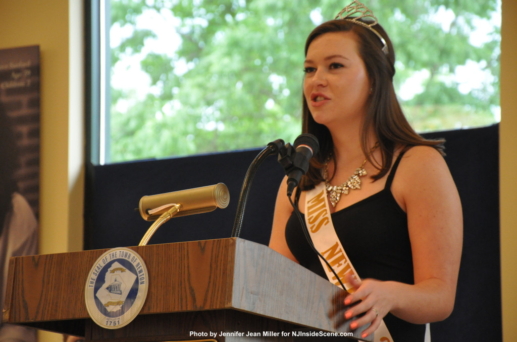 Miss Newton 2013, Lauren Hennighan, speaks at the podium before the new winners were honored.
