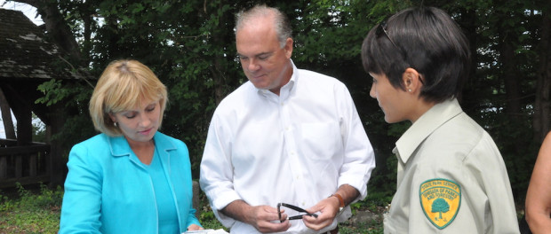 Lieutenant Governor Kim Guadagno (right), NJ DEP Commissioner Bob Martin (center) and Blanca Chevrestt the Superintendent of Swartswood State Park (right) review a map of the park that Chevrestt presented to Guadagno during her visit. Photo by Jennifer Jean Miller.