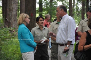 Swartswood State Park Superintendent Blanca Chevrestt (center) stops to speak with Lieutenant Governor Kim Guadagno (left) and NJ DEP Commissioner Bob Martin (right) after stopping to the large patch of raspberries within the park. Photo by Jennifer Jean Miller.