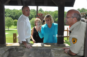 NJ DEP Commissioner Bob Martin, Sussex County Chamber of Commerce President Tammie Horsfield, Lieutenant Governor Kim Guadagno, and Regional Parks' Superintendent Steve Ellis, stop to visit the park's wishing well. Photo by Jennifer Jean Miller.