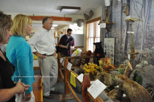 Sussex County Chamber of Commerce President Tammie Horsfield (left) views the display at the Swartswood State Park interpretative center with Lieutenant Governor Kim Guadagno (center) and NJ DEP Commissioner Bob Martin (right). Photo by Jennifer Jean Miller.