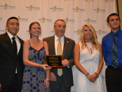 New Jersey Labor Commissioner Harold J. Wirths (center) holds a plaque commemorating his support for Kid's Chance New Jersey, which issued six scholarships, each for $10,000, to students who had a parent killed or catastrophically injured at work. Scholarship recipients included (from left to right) Pedro Morejon of Lyndhurst, Alexandra Kurnath and Mackenzie Kurnath of Seaside Park (formerly of Chester) and Scott Kwiatek of South Amboy. The two other scholarship recipients were Marie Molinaro of Rockaway and Trent Schamble of Vernon.