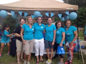 Dr. Gloria Patino (center) with the staff of The Attentive Dentist, LLC, visited with attendees and passed out gift bags. Photo by Jennifer Jean Miller.