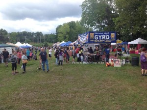 Food vendors and other businesses were situated at the large field during the festival. Photo by Jennifer Jean Miller.