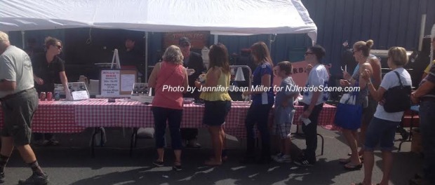Event goers wait for grilled eats at Charlie Shay's Traveling BBQ. Photo by Jennifer Jean Miller.