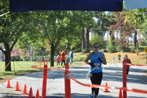 Tina Santos was third in the 5K race overall and first for the women. Photo by Jennifer Jean Miller.