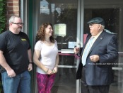 Keri Marino, owner of PEARLL Yoga for the Soul, opens the doors for her business with husband Tony (left) and Franklin Borough Mayor Paul Crowley (right). Photo by Jennifer Jean Miller.