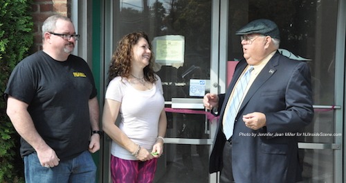 Keri Marino, owner of PEARLL Yoga for the Soul, opens the doors for her business with husband Tony (left) and Franklin Borough Mayor Paul Crowley (right). Photo by Jennifer Jean Miller.