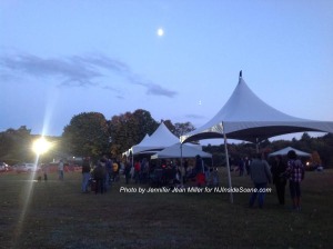The moon rises over the Middleville Music Festival. Photo by Jennifer Jean Miller.