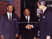 Dr. Martin Luther King Jr. in this stunning color photo, courtesy of the Drew University Library Archive. To his left is Dr. George Kelsey, who had been his mentor and a professor, and was then a professor at Drew. To his right, is Drew University President Robert F. Oxnam. Behind Dr. King is an assortment of items behind glass in tribute to him.