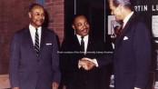Dr. Martin Luther King Jr. in this stunning color photo, courtesy of the Drew University Library Archive. To his left is Dr. George Kelsey, who had been his mentor and a professor, and was then a professor at Drew. To his right, is Drew University President Robert F. Oxnam. Behind Dr. King is an assortment of items behind glass in tribute to him.