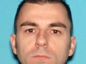 Kristopher Dohm, age 36, currently sought for leaving the state with his two children and is in violation of his custody agreement. Photo courtesy of the New Jersey State Police and Hopatcong Police Department.