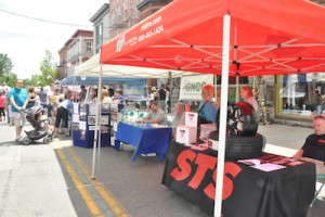The Greater Newton Chamber of Commerce (GNCC) has a booth along with the Town of Newton and Newton Police. STS was adjacent to the GNCC. Photo by Jennifer Jean Miller. 