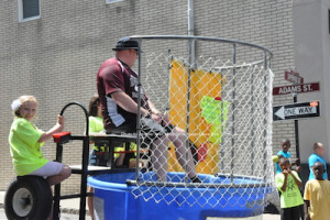 Officer Ken Teets smiles as he waits for his dunk. Photo by Jennifer Jean Miller.