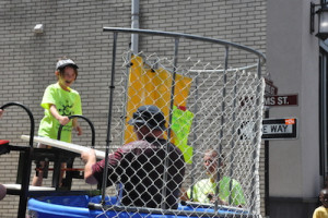 Officer Ken Teets rises to take his seat again after being sent into the dunk tank. Photo by Jennifer Jean Miller.