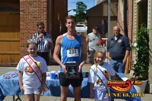 USA National Miss Northern New Jersey Princess Mackenzie Genung and Miss Heart Of America NJ Danielle Penny flank 5K winner Chartt Miller as he is presented with his plaque. Photo courtesy of the Firehouse 5K. 