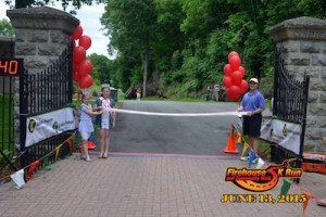 USA National Miss Northern New Jersey Princess Mackenzie Genung and Miss Heart Of America NJ Danielle Penny at the finish line with Town of Newton Town Manager Thomas S. Russo Jr. Photo courtesy of the Firehouse 5K.