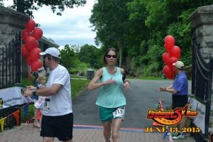 Stephanie McNeely crosses the finish line. Photo courtesy of the Firehouse 5K. 