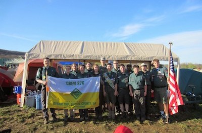 The group poses at their campsite with West Point Cadet Mitchell Valenza. Image courtesy of Venturing Crew 276.