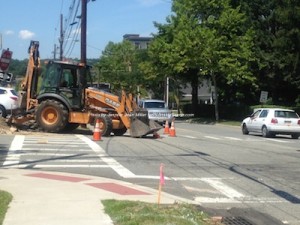 Workers begin to prepare Trinity Street for the new traffic signals. Photo by Jennifer Jean Miller.