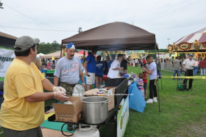 Franklin Recreation volunteers dishing out burgers and hot dogs. Photo by Jennifer Jean Miller.