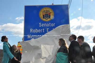 The sign cover is moved away. Photo by Jennifer Jean Miller.