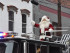 Santa atop the Newton Fire Department ladder truck waves to the crowd. Photo by Jennifer Jean Miller.