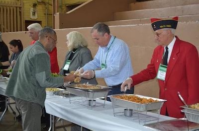 Commissioner Harold J. Wirths of the New Jersey Department of Labor serving a hot lunch to homeless veterans and volunteers at the Stand Down in Morristown. Image courtesy of the Department of Labor.