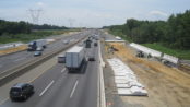 Motorists travel along a stretch of the New Jersey Turnpike. Creative commons image.